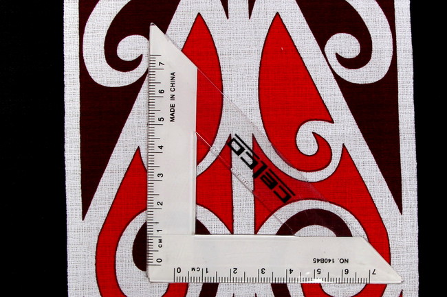 * REMNANT - Red & White on Black Traditional Maori Design Printed Dobby