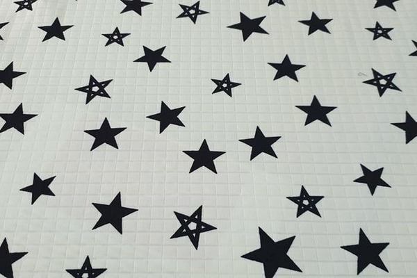Quilted Polyester - Black Stars on Cream