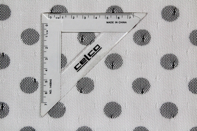 Black Spots on White Netting