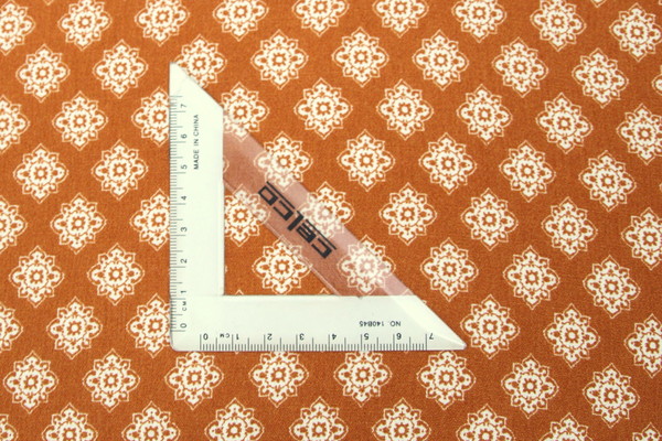 Classic White Floral Design on Gingerbread Printed Rayon with Crepe Finish