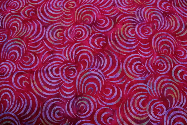 Raspberry Batik Cotton with Multi-Coloured Curves
