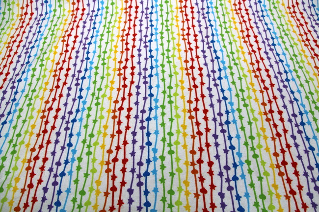 Rainbow Streamers on White Printed Flannelette