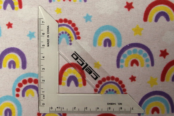 Rainbows on Palest Pink Printed Flannelette