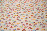 Rainbows on Palest Pink Printed Flannelette