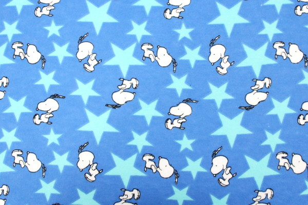 Jumping Snoopy Over Stars on Printed Blue Flannelette